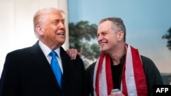 Президентът на САЩ Доналд Тръмп и американският учител Марк Фогъл, който беше освободен от руски затвор. 11 февруари 2025 г.