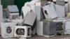 Old electrical appliances in container of recycling center.