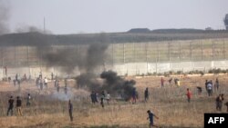 Сцена от сблъсъците между протестиращите палестинци и израелските гранични служители